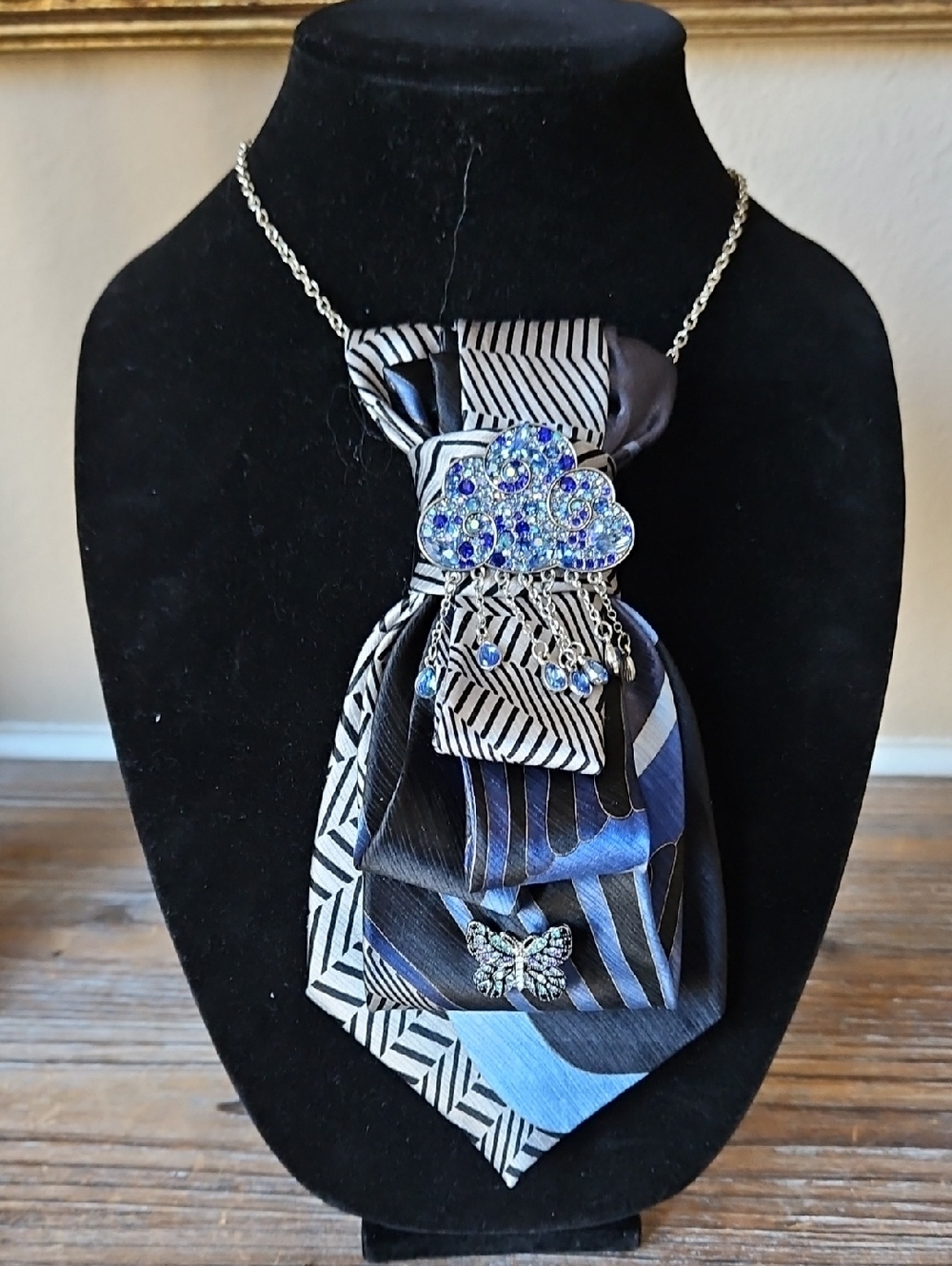 Blue Crystal Cloud Necktie Necklace with a Butterfly Pin.
